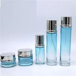 Ampolla de crema d'ampolla d'essència de gradient blau cel de marca pròpia amb personalització d'alta qualitat